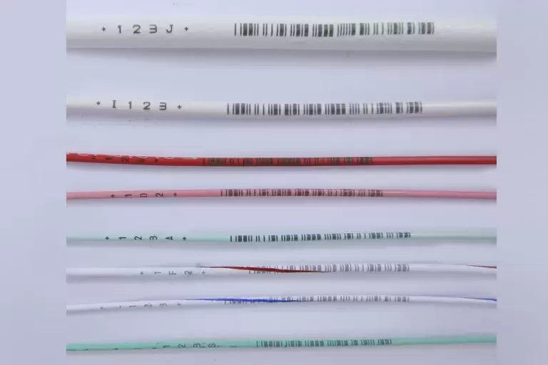 Multi colors wire with black lines on wrapper.